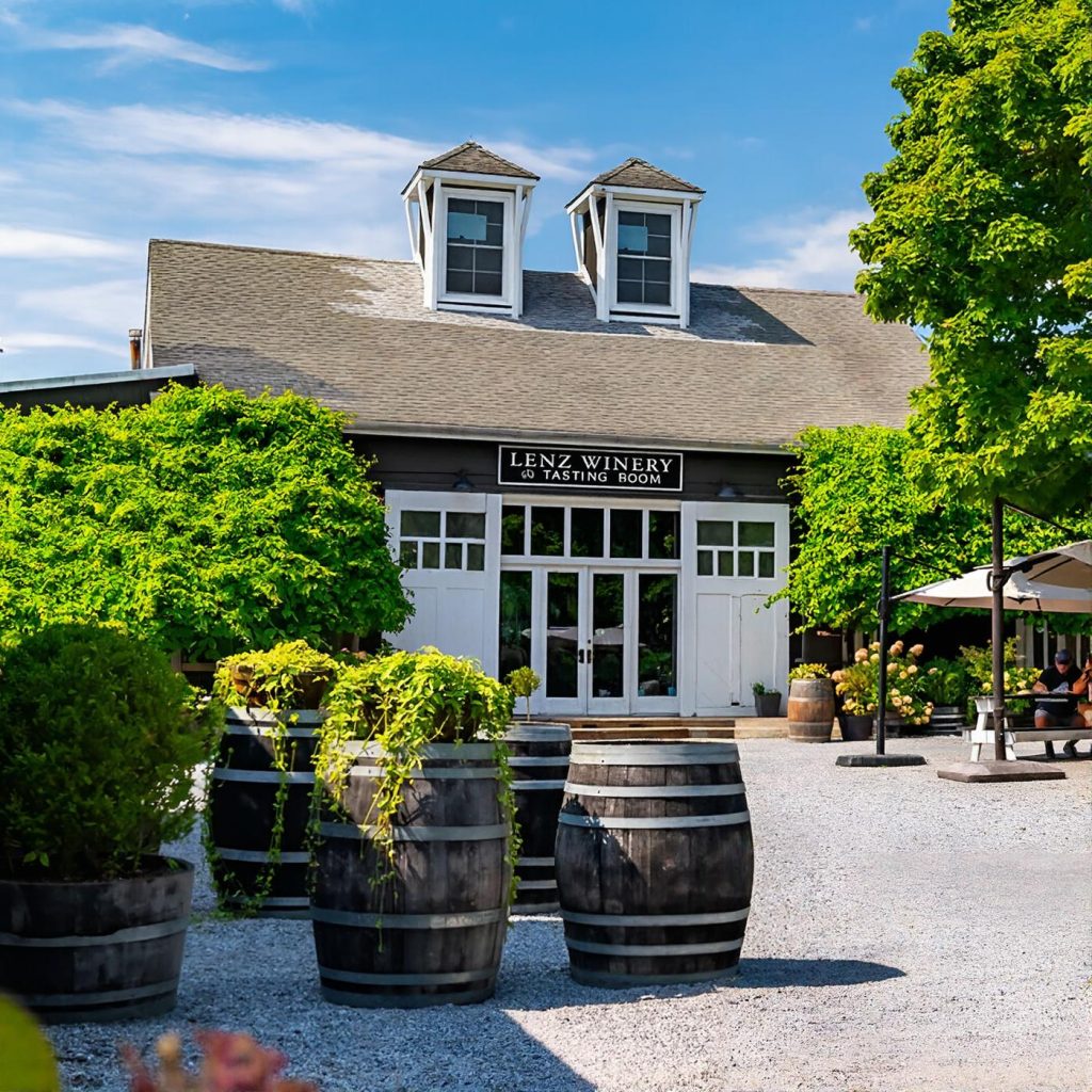 Outdoor grounds with house and barn at Lenz Winery on the North Fork of Long Island during a Long Island wine tour.