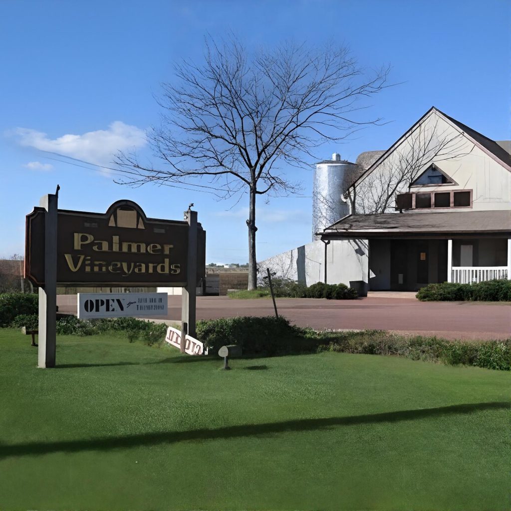 Roadside sign and winery house at Palmer Vineyards on the North Fork of Long Island during a private chauffeured wine tour.