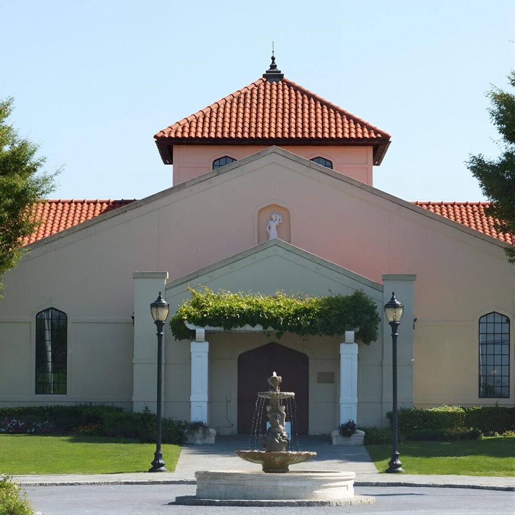 Entrance to Raphael Winery with a decorative fountain in front on the North Fork of Long Island during a private chauffeured wine tour.
