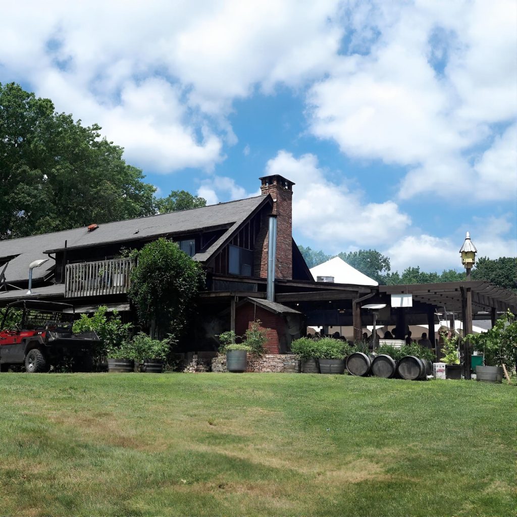 House and lawn at Benmarl Winery in the Hudson Valley during a chauffeured wine tasting tour from Long Island.