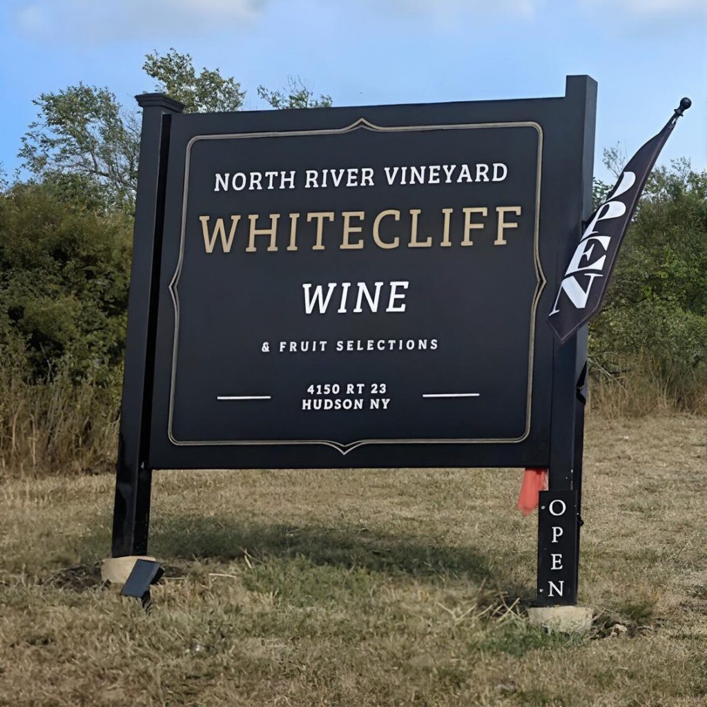 Entrance sign for Whitecliff Vineyard at Hudson in the Hudson Valley during a chauffeured wine tasting tour from Long Island.